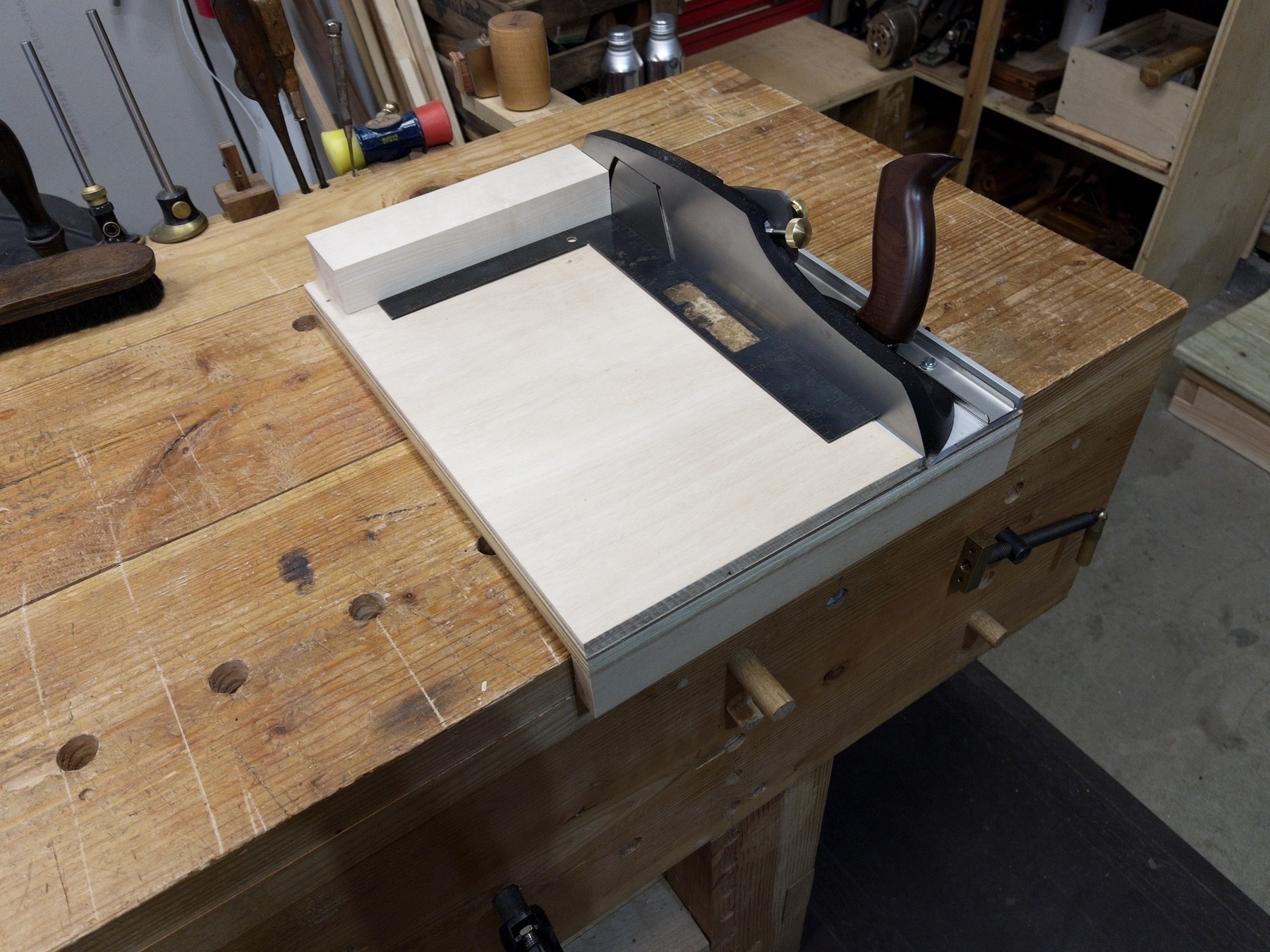 shooting plane with new shooting board on woodworking table